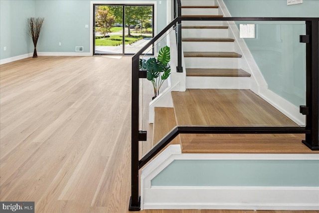 261 Moore St, Princeton, NJ 08540 - staircase with baseboards, visible vents, and wood finished floors