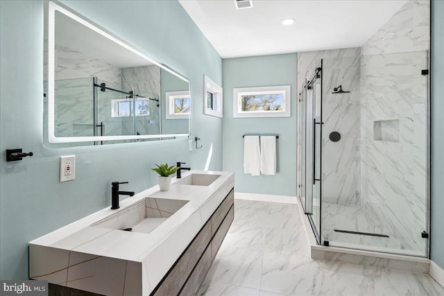 261 Moore St, Princeton, NJ 08540 - bathroom featuring a marble finish shower, marble finish floor, baseboards, and a sink