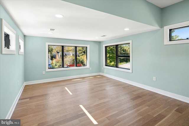 261 Moore St, Princeton, NJ 08540 - empty room with a wealth of natural light, baseboards, and wood finished floors