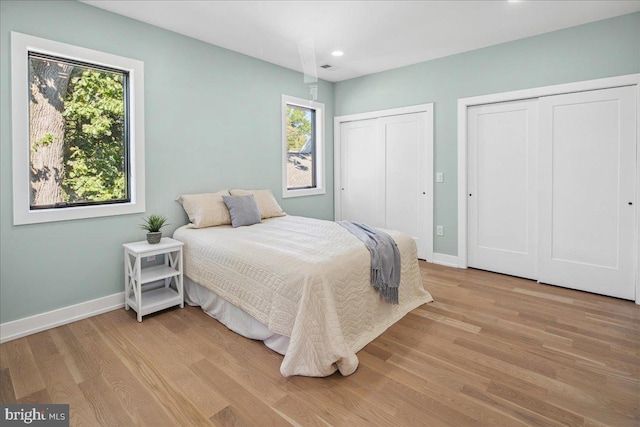 261 Moore St, Princeton, NJ 08540 - bedroom with baseboards, multiple windows, and two closets