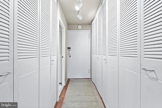 corridor with light wood-type flooring