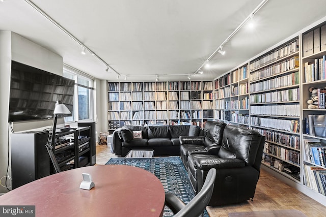 living room with rail lighting and parquet floors