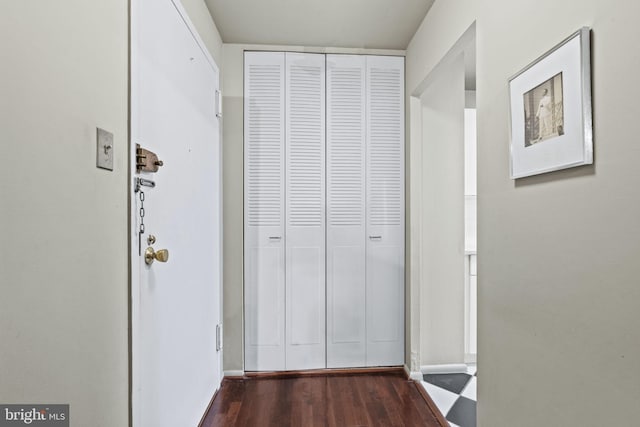 hallway featuring dark hardwood / wood-style floors