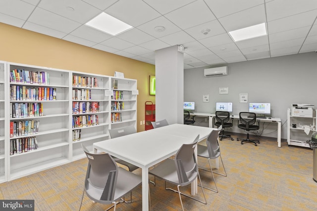 carpeted dining room with a drop ceiling and a wall unit AC