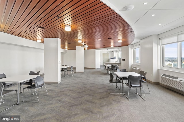 dining room with wooden ceiling and dark carpet