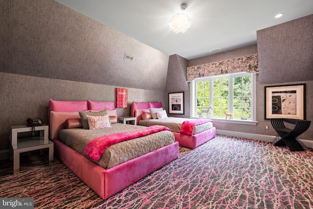 carpeted bedroom with lofted ceiling