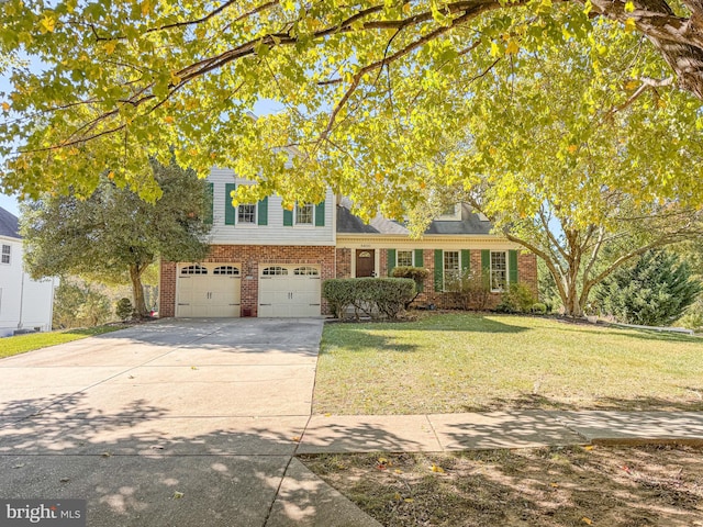 view of front of property featuring a garage and a front lawn