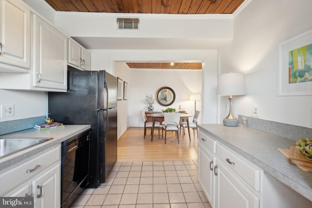 kitchen with crown molding, wooden ceiling, light tile patterned floors, dishwasher, and white cabinets