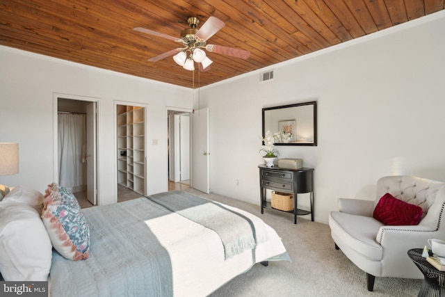 bedroom with ornamental molding, light colored carpet, and wooden ceiling