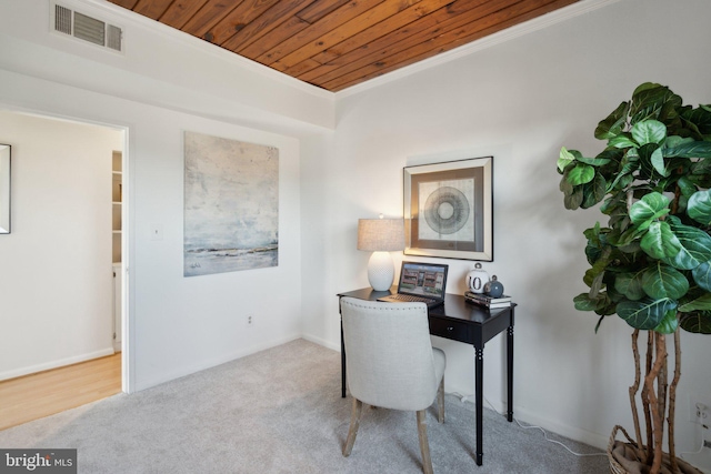 carpeted home office featuring wood ceiling and ornamental molding