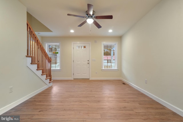 entryway with ceiling fan and light hardwood / wood-style flooring