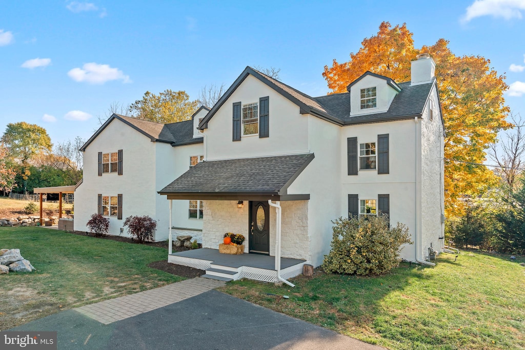 front facade with a front lawn