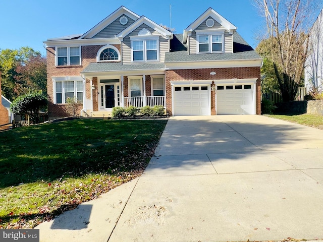 view of front of property featuring covered porch, a garage, and a front lawn