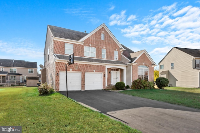 front of property with a front yard and a garage