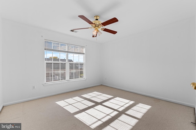 carpeted empty room with ceiling fan