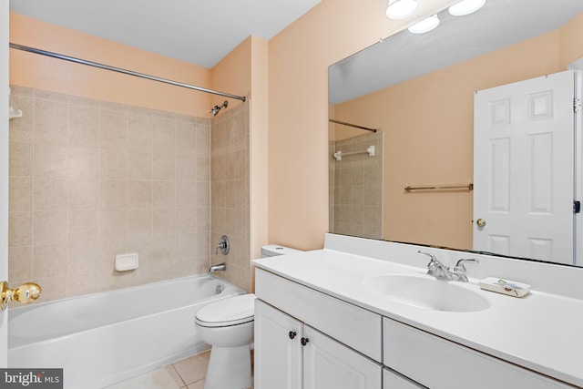 full bathroom with tiled shower / bath, vanity, toilet, and tile patterned flooring