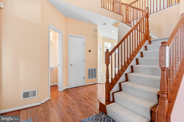 stairway featuring hardwood / wood-style flooring