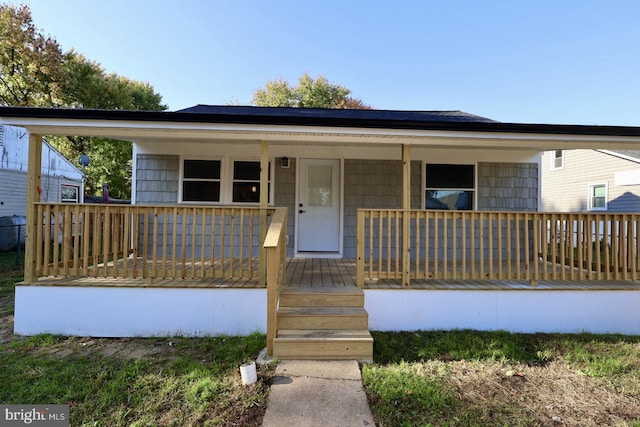 view of front of home featuring covered porch