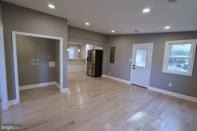 entrance foyer featuring light hardwood / wood-style floors and electric panel