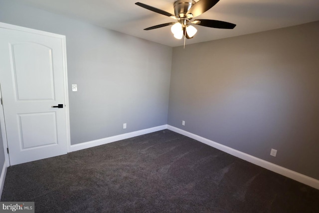 carpeted spare room with ceiling fan