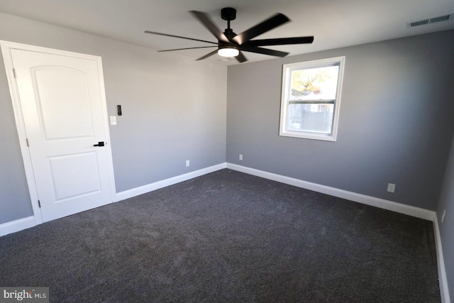 carpeted empty room featuring ceiling fan