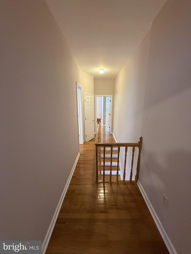 hall with dark hardwood / wood-style floors