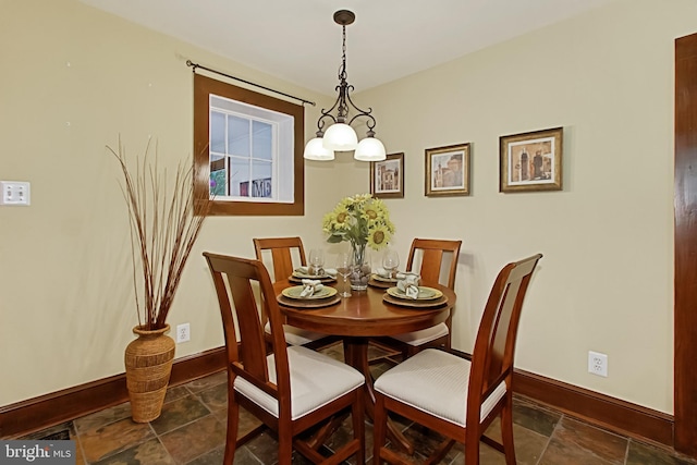 dining room featuring a notable chandelier