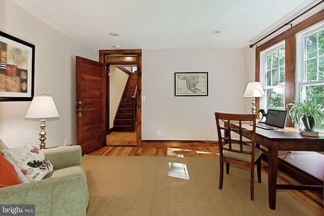 home office with hardwood / wood-style floors