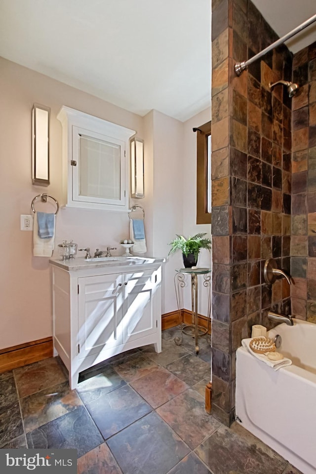 bathroom with vanity and tiled shower / bath combo