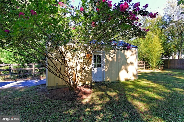 view of outdoor structure with a lawn