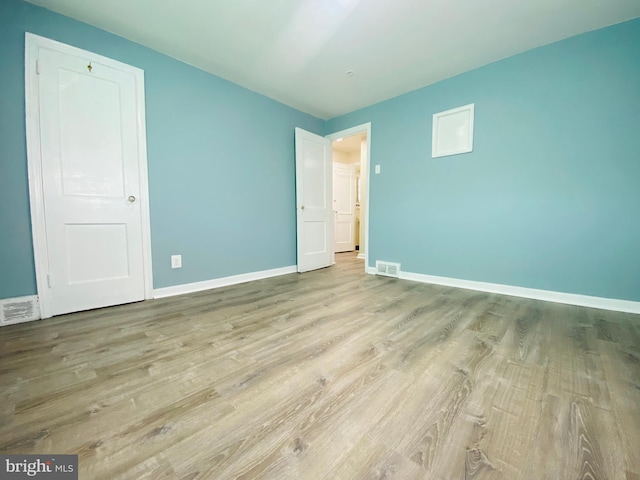 unfurnished bedroom with light hardwood / wood-style flooring