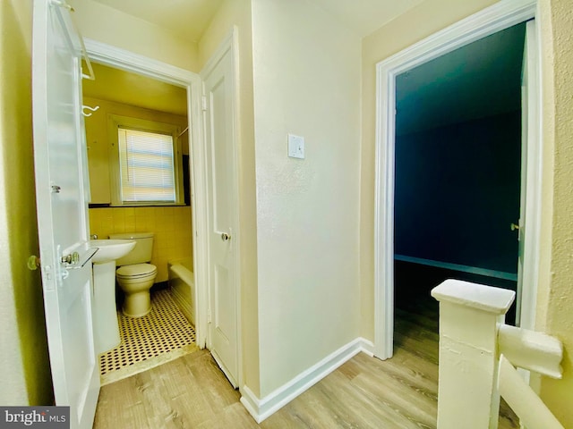 bathroom featuring toilet and hardwood / wood-style floors