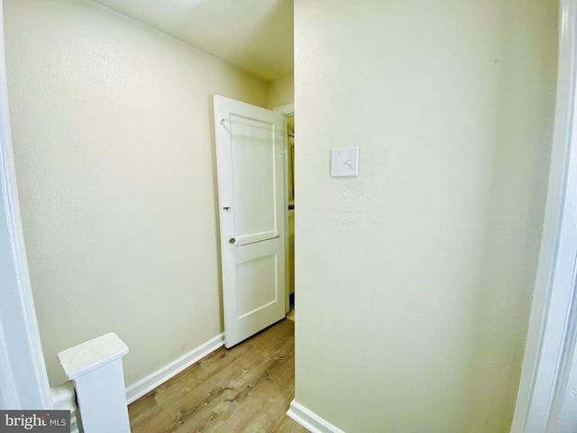 corridor featuring light hardwood / wood-style flooring