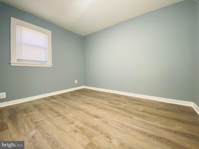 spare room featuring light hardwood / wood-style floors