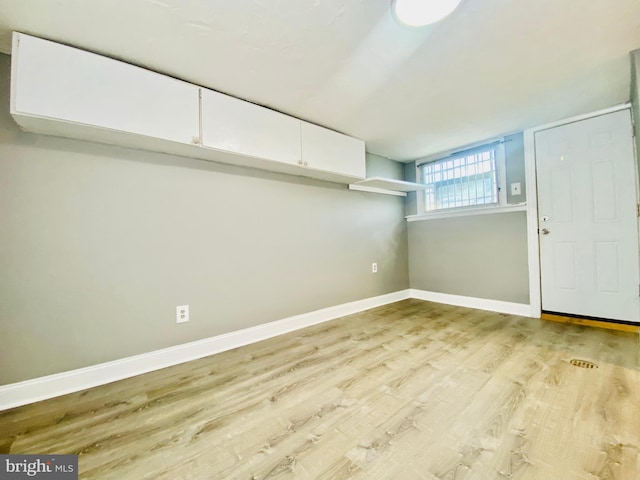 basement featuring light hardwood / wood-style flooring