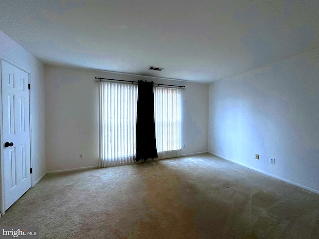 empty room with light colored carpet