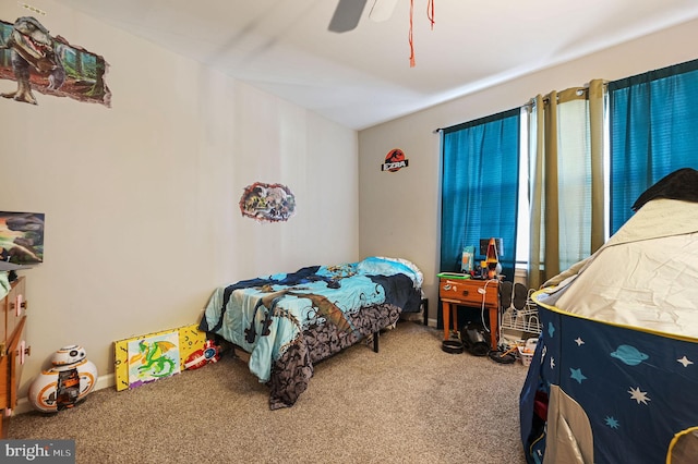 bedroom featuring ceiling fan and carpet floors