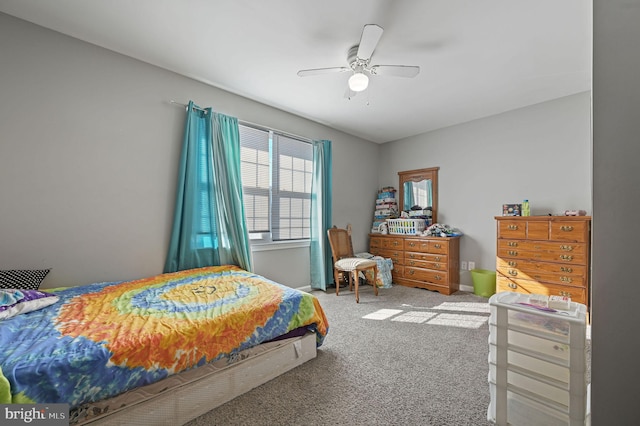 bedroom featuring ceiling fan and carpet