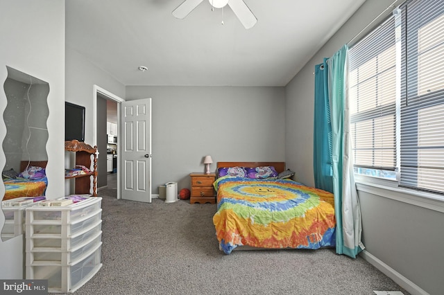 bedroom featuring multiple windows, carpet flooring, and ceiling fan