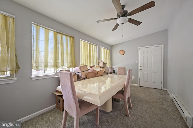 dining space featuring lofted ceiling, carpet, ceiling fan, and a baseboard heating unit