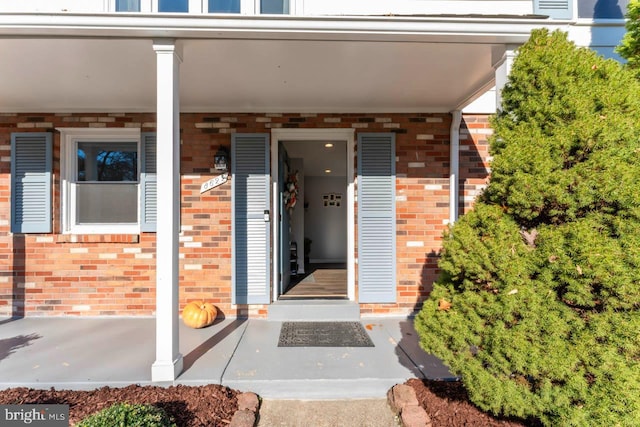 doorway to property with a porch