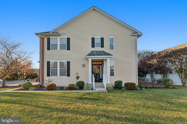 front facade featuring a front lawn