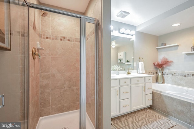 bathroom with separate shower and tub, tile patterned flooring, and vanity