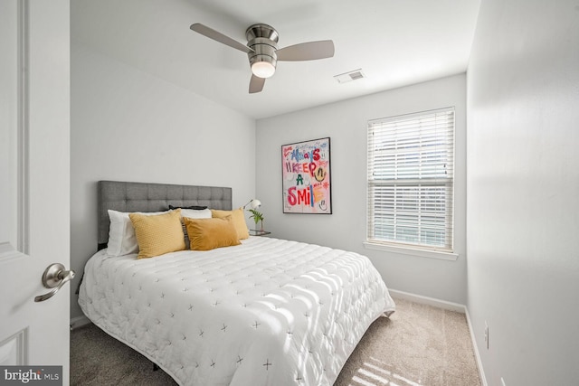 bedroom with ceiling fan and carpet floors