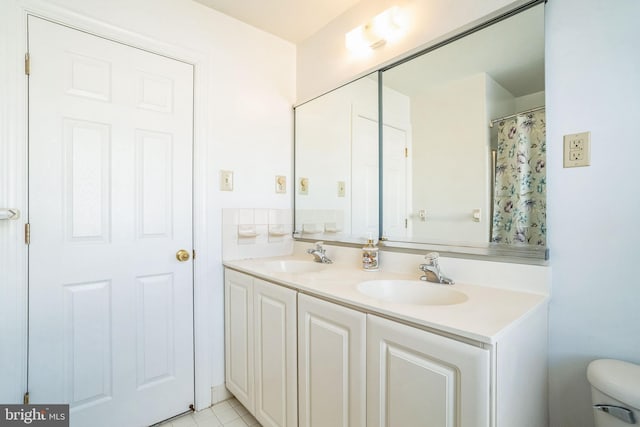 bathroom with vanity and tile patterned flooring