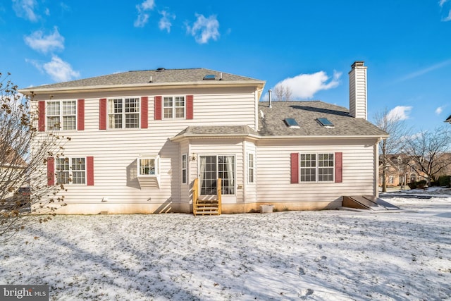 view of snow covered house