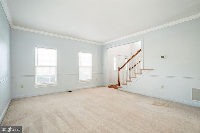 unfurnished living room with crown molding and light colored carpet