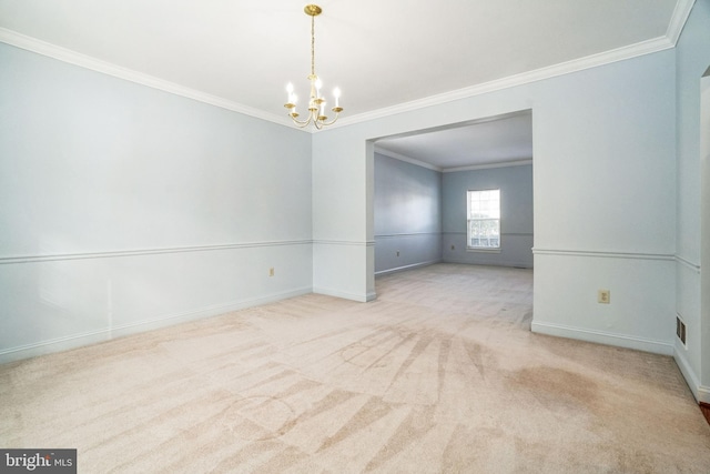 carpeted empty room featuring a notable chandelier and crown molding