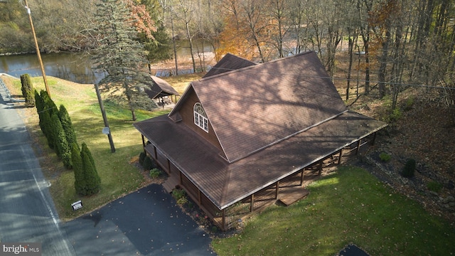 birds eye view of property with a water view