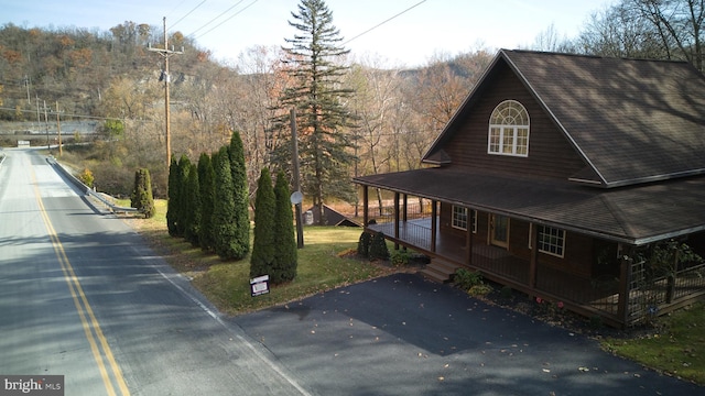 view of home's exterior featuring covered porch